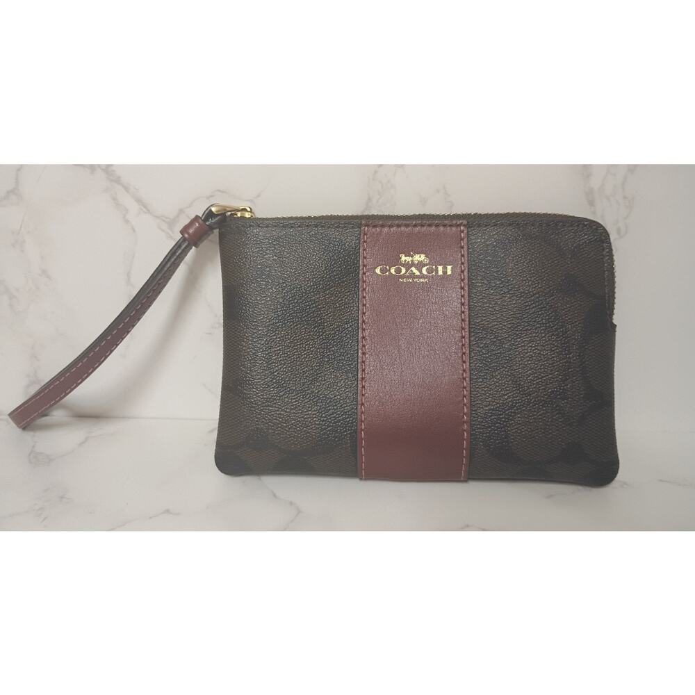 COACH Signature‎ Monogram Dark Brown/Burgundy Corner Zip Wristlet  - EUC